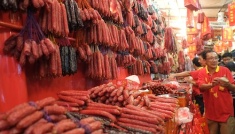 A vendor sells waxed sausages for Chinese New Year at Chinatown, Singapore